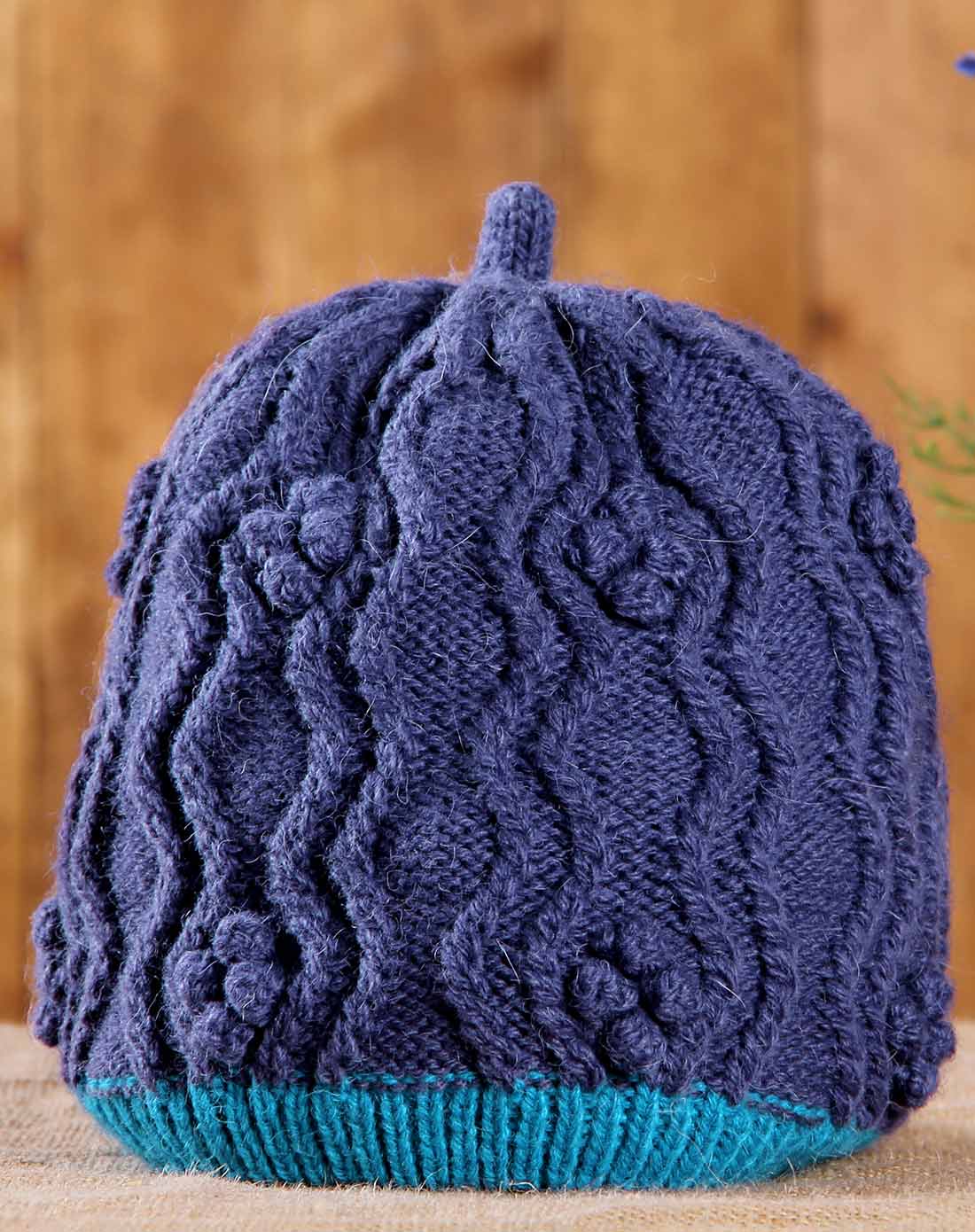 蓝色间色绞花织花混纺毛线帽子