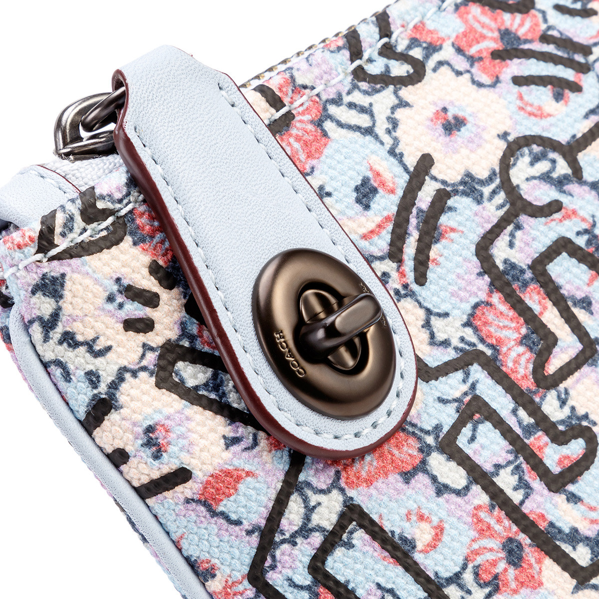 coach蔻驰 keith haring系列旋锁手拿包