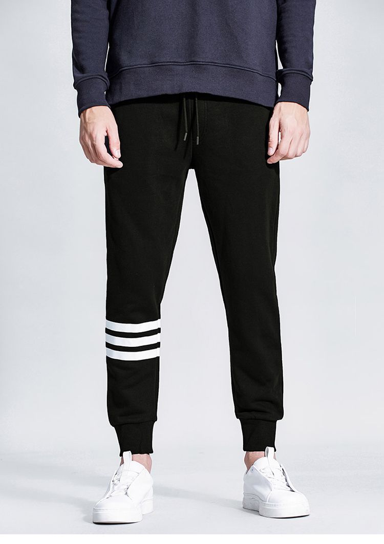 黑色裤腿三道杠印花针织长裤