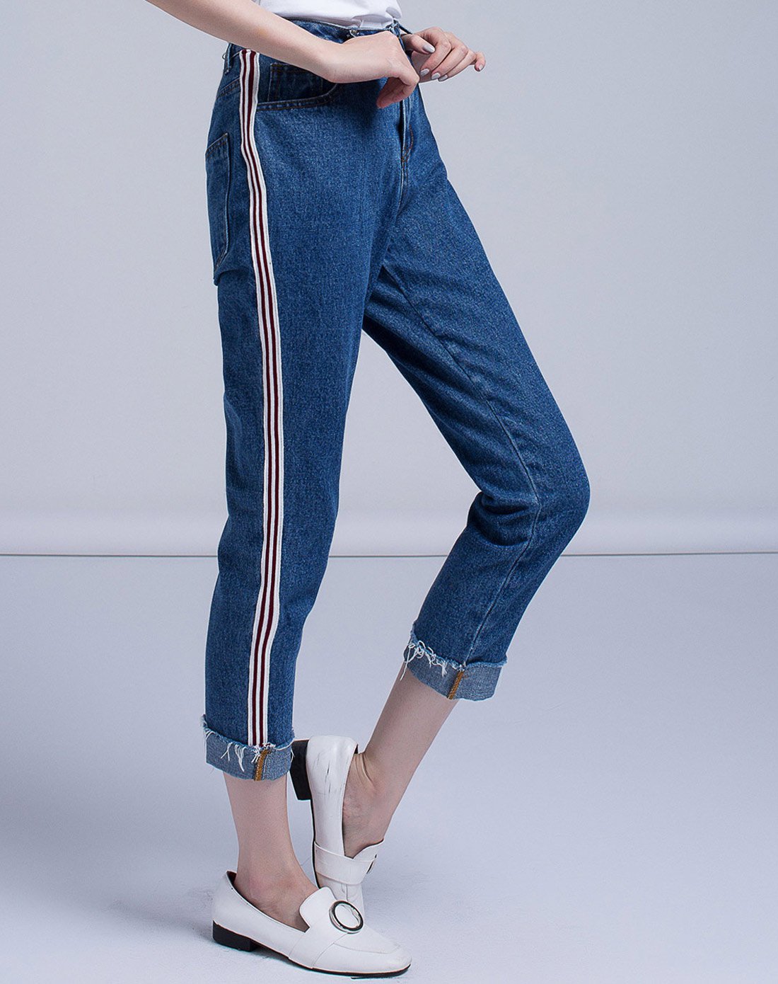 织带拼接裤脚翻边显瘦牛仔小脚八分裤