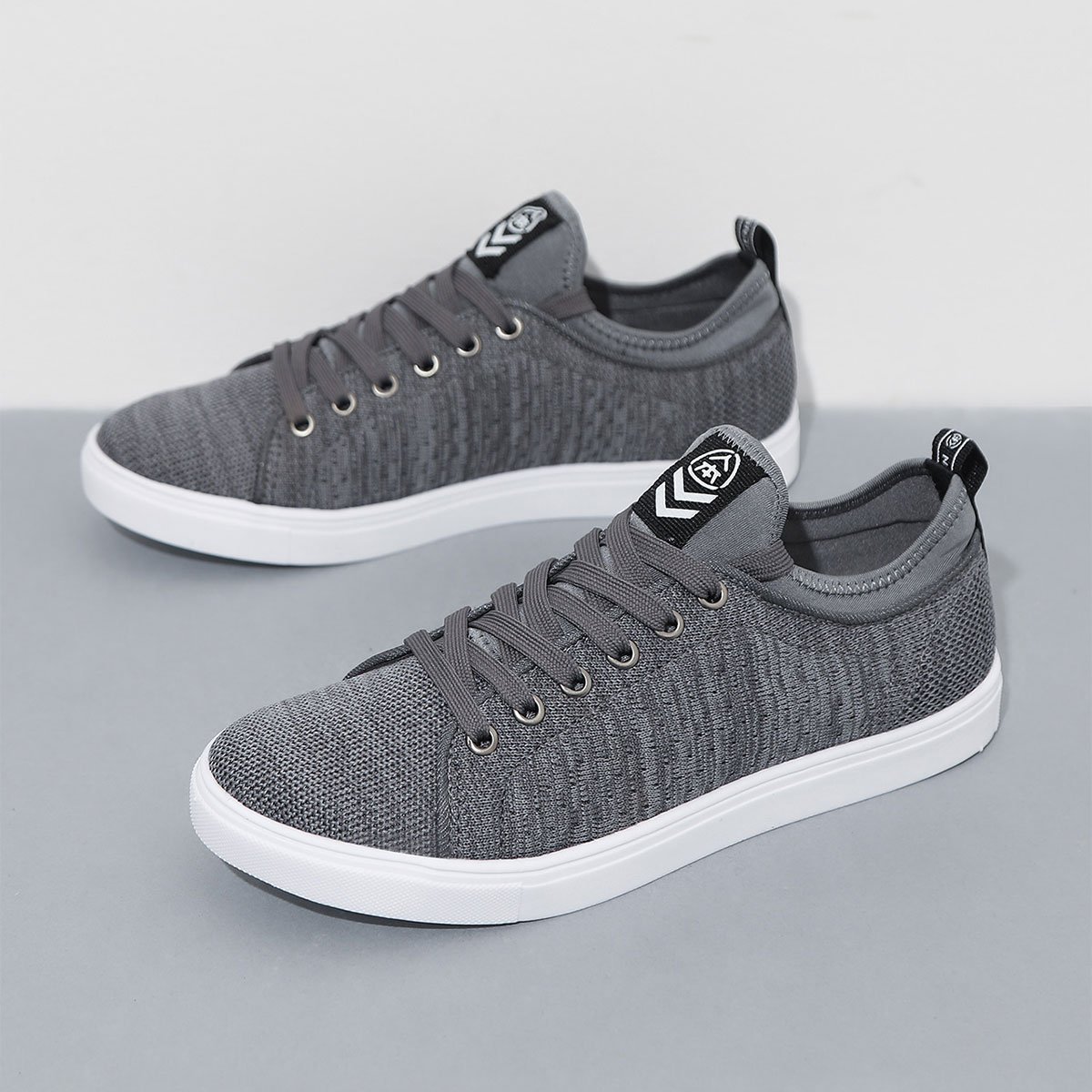 人本 男款低帮飞织时尚板鞋透气系带平底百搭休闲鞋